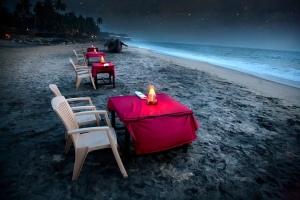Romantic café on the beach at night — 图库照片