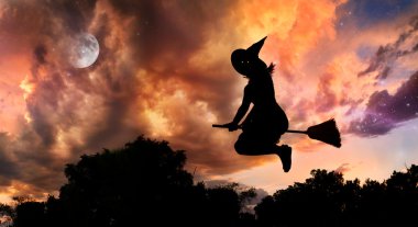 Flying witch on broomstick clipart