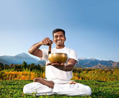 Yoga meditation with Tibetan bowl clipart