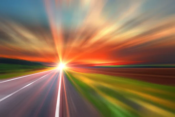 Blurred road and blurred sky with sunset — Stock Photo, Image