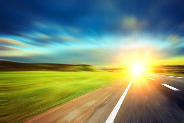 Blurred road and blurred sky with sunset — Stock Photo, Image
