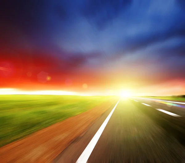stock image Blurred Road with blurred sky with sun