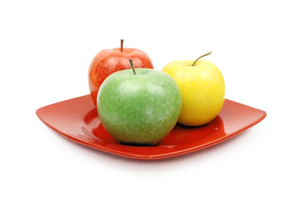 Apples on red plate — Stock Photo, Image