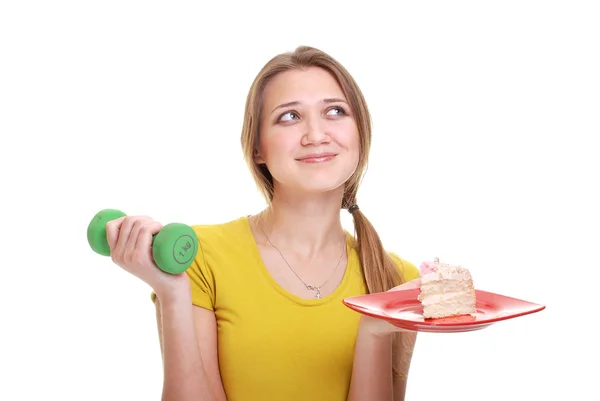 Mulher com esponja e bolo no prato — Fotografia de Stock