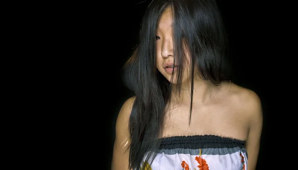 stock image Portrait of beautiful asian girl on black background