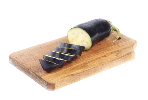 Sliced eggplant on a cutting board isolation on white