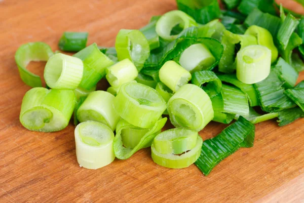 stock image Fresh sliced onions on cutting board