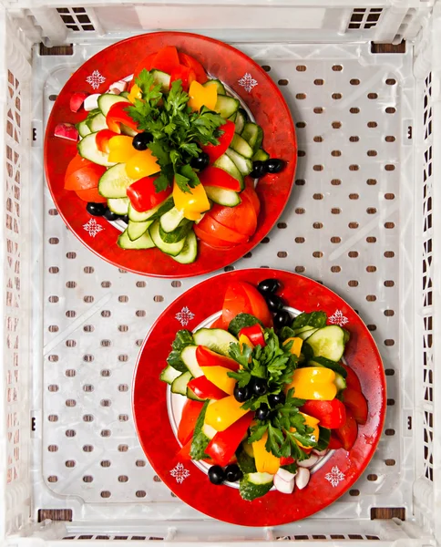 Two plates with vegetables in white box — Stock Photo, Image