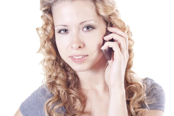 Young woman talking by mobile Royalty Free Stock Photos