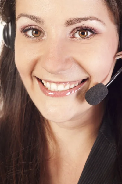 Lachende vrouw exploitant met headset — Stockfoto