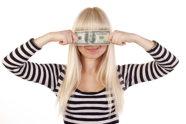 Jovem mulher segurando dólar sobre seus olhos — Fotografia de Stock