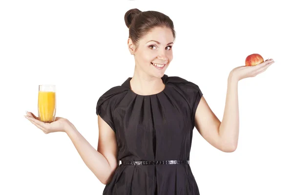 Młoda kobieta z szklankę soku i jabłko — Zdjęcie stockowe