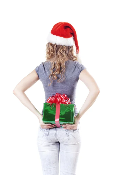 Santa dívka schovává přítomen dárek pro nový rok — Stock fotografie