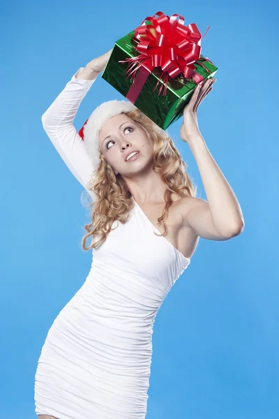 Pretty Santa girl with a present gift for New Year — Stock Photo, Image