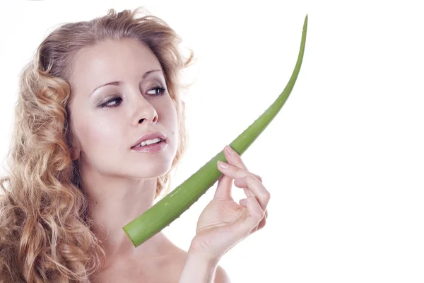 Beautiful young woman with aloe — Stock Photo, Image