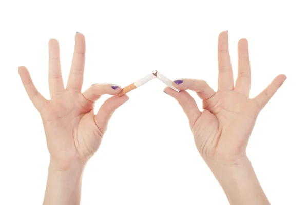 Woman's hand crushing cigarette — Stock Photo, Image