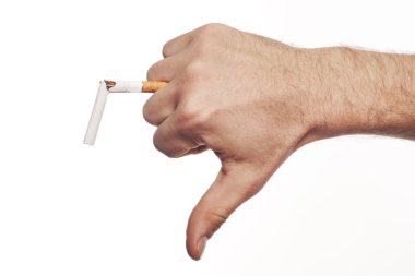 Man's hand crushing cigarette clipart