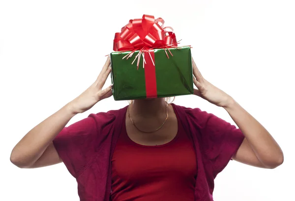 Young woman with a present gift over her face — Stock Photo, Image
