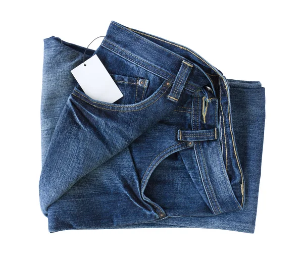 Nové modré džíny kalhoty a tag — Stock fotografie