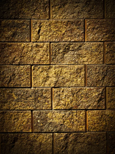 Dark gold brick wall — Stock Photo, Image
