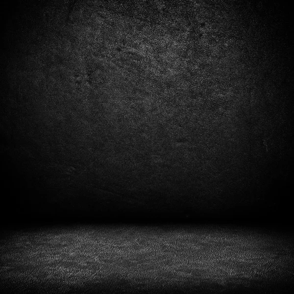 Schwarze Wand aus dunklem Leder und schwarzer Fußboden — Stockfoto