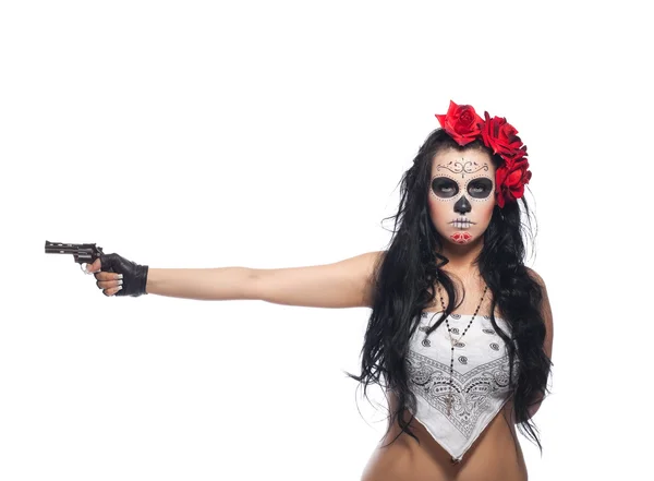 Serious woman in day of the dead mask with gun — Stock Photo, Image
