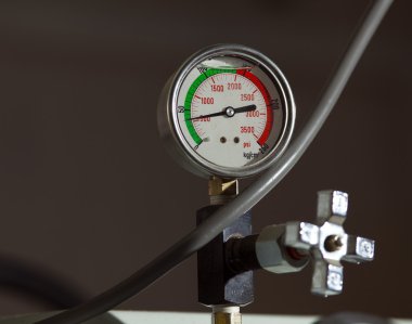 Industrial pressure barometer at green line clipart
