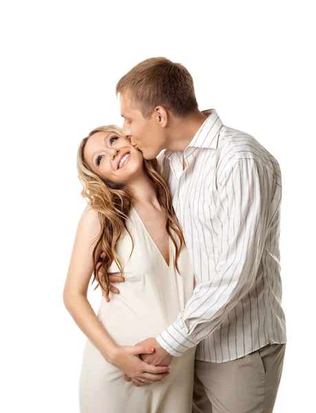 Young couple in white wait for baby kiss a whife — Stock Photo, Image