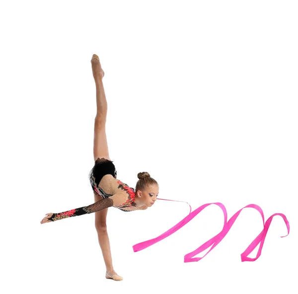 Teenager doing gymnastics split with ribbon — Stock Photo, Image