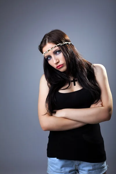 Grunge sad girl in tank top with cross on breast — Stock Photo, Image