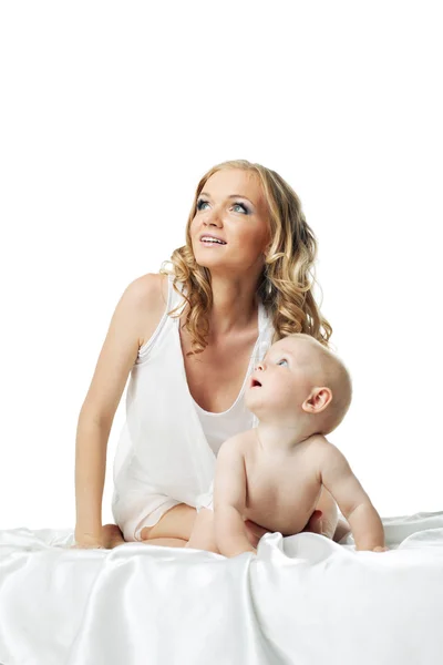 Cute mom with baby look at light — Stock Photo, Image