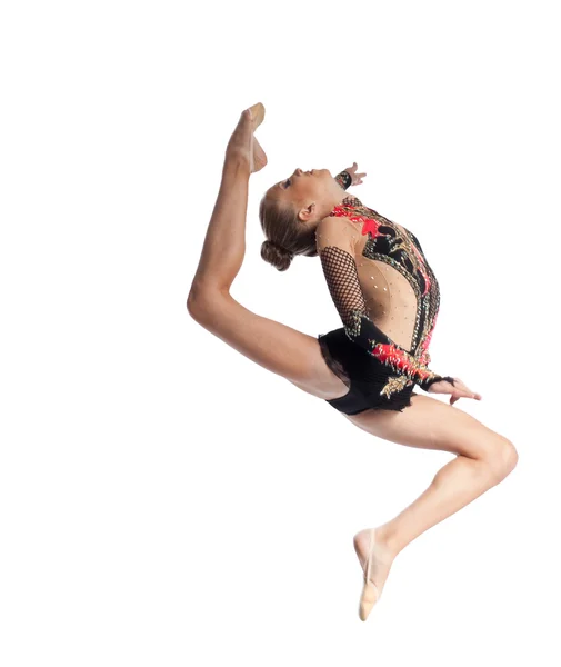 Молода дівчина стрибає в гімнастичному танці — стокове фото