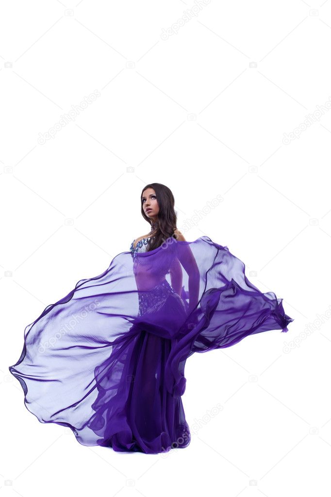Arabia dancer posing in oriental flying fabric