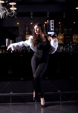 Beauty woman stand near bar in luxury cloth