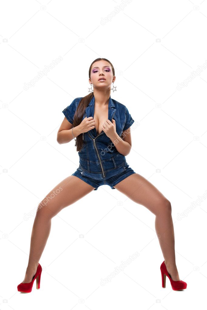 Sexy girl posing in jeans dress isolated