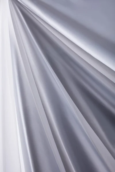 Textura de fondo de ondas de tela de seda blanca de cerca — Foto de Stock
