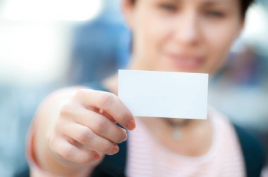 White card in a hand clipart