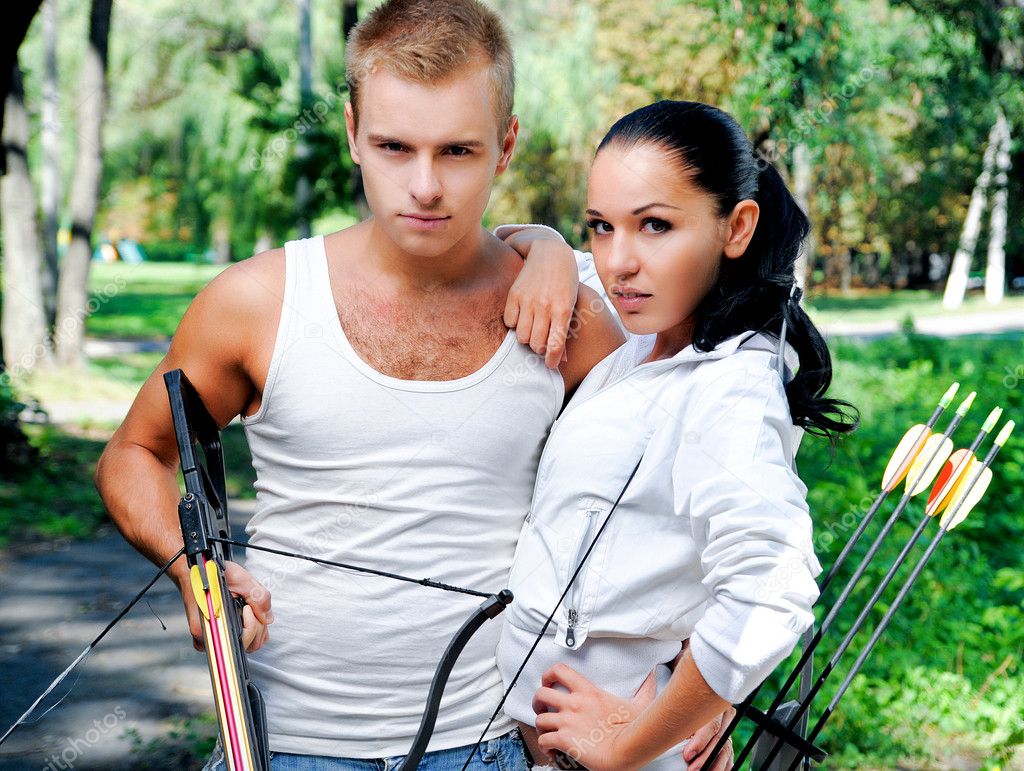 Young couple with a bow and arrows