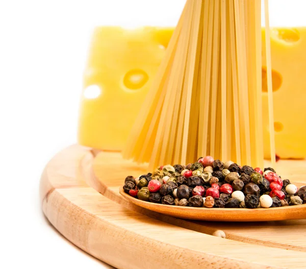 Raw spaghetti with cheese and spices — Stock Photo, Image