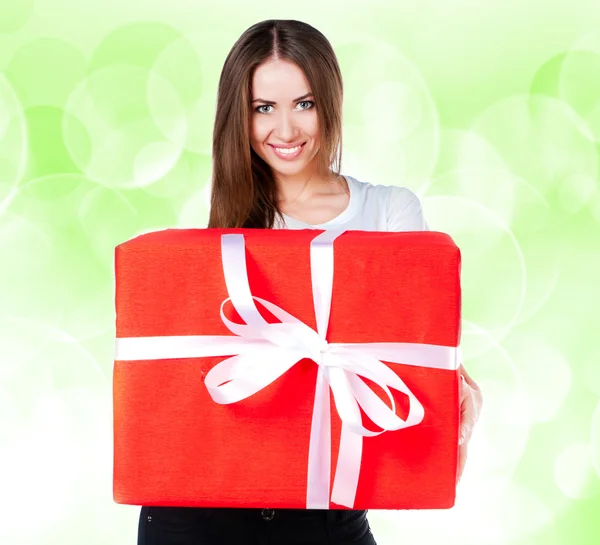 Cute young girl with a gift — Stock Photo, Image
