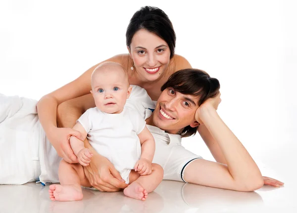 Junge glückliche Familie mit Kind — Stockfoto