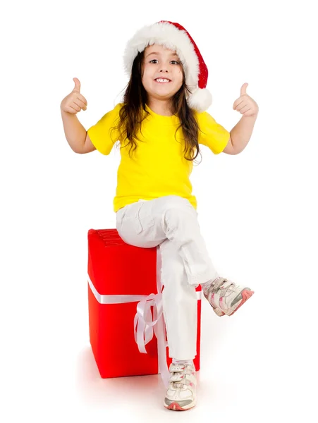 Ragazza con regali in cappello di Babbo Natale — Foto Stock