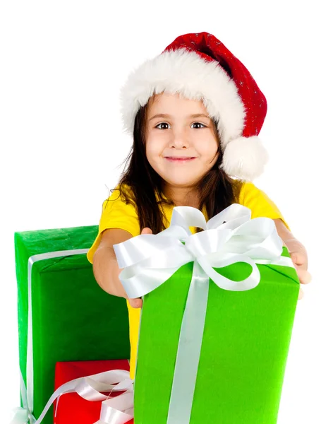 Mädchen mit Geschenken in Weihnachtsmütze lizenzfreie Stockbilder