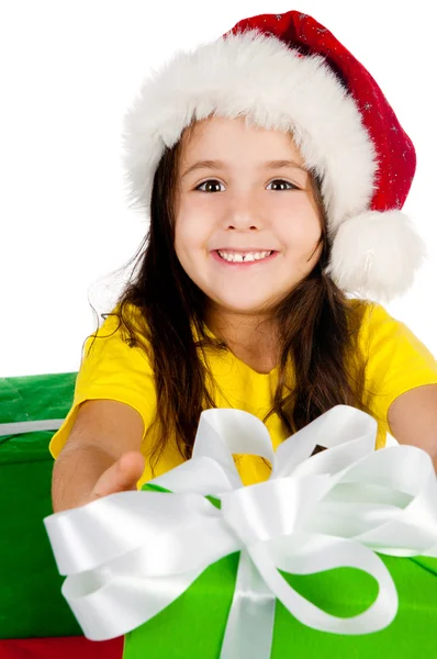 Mädchen mit Geschenken in Weihnachtsmütze Stockfoto