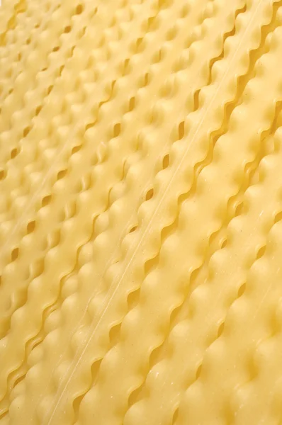 stock image Uncooked pasta texture on table