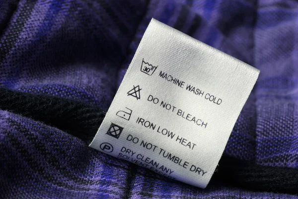 衣服标签上苏格兰威士忌纺织背景 免版税图库图片