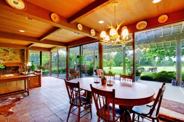 Dining room with green view and windows wall clipart