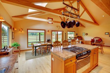 Large living room on the horse ranch with the kitchen. clipart