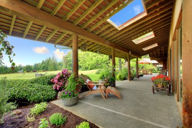 Large ranch covered porch with flowers clipart