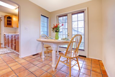 Happy dining room with orange tile floor clipart